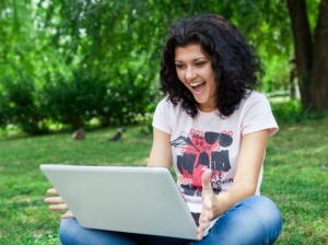 girl-using-laptop-in-park